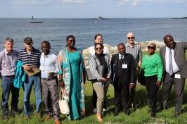 A photo of a group of people set against the backdrop of the Gulf of Maine